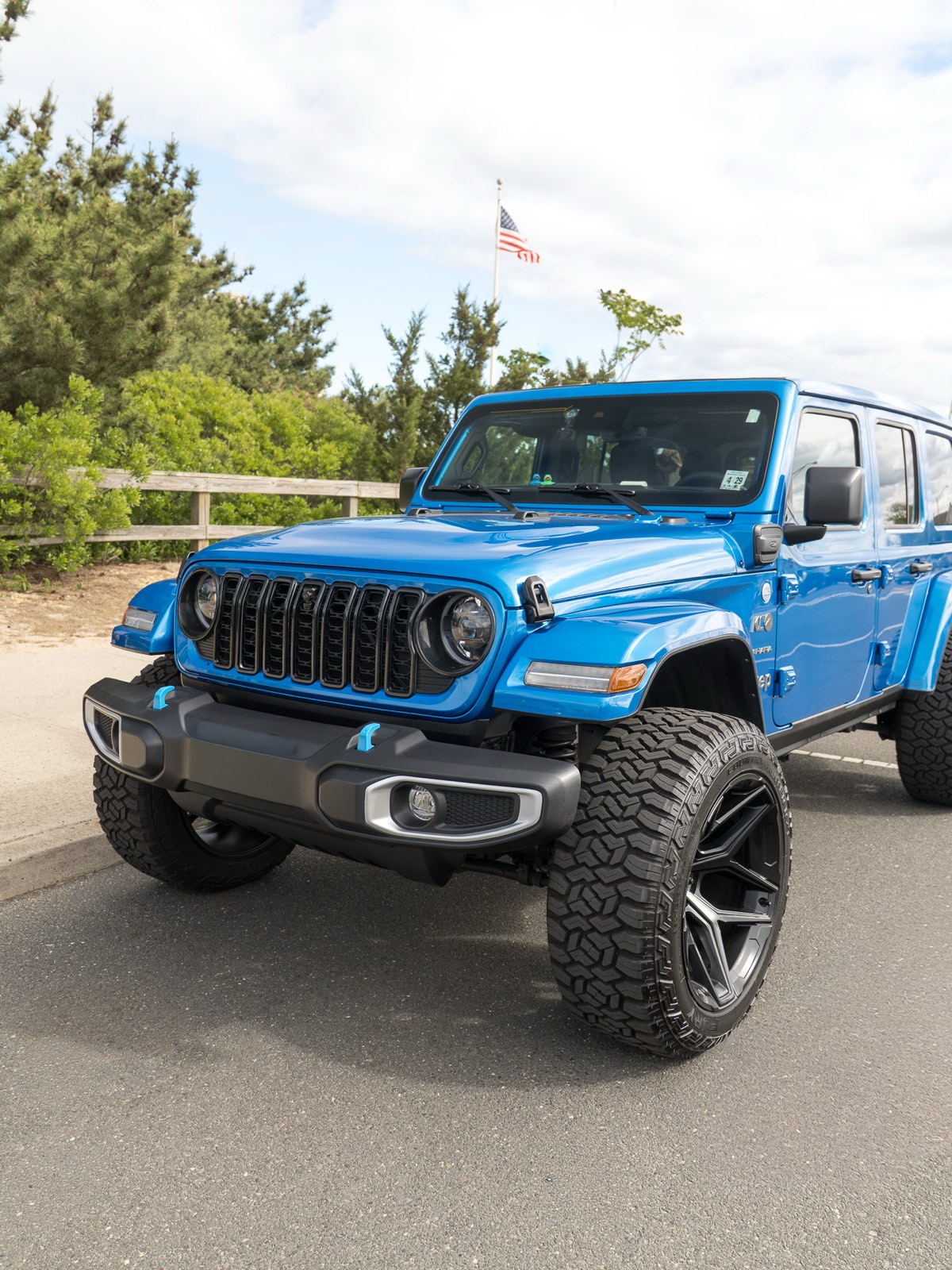 Blue Jeep Wrangler 4xe detailed — front three-quarter