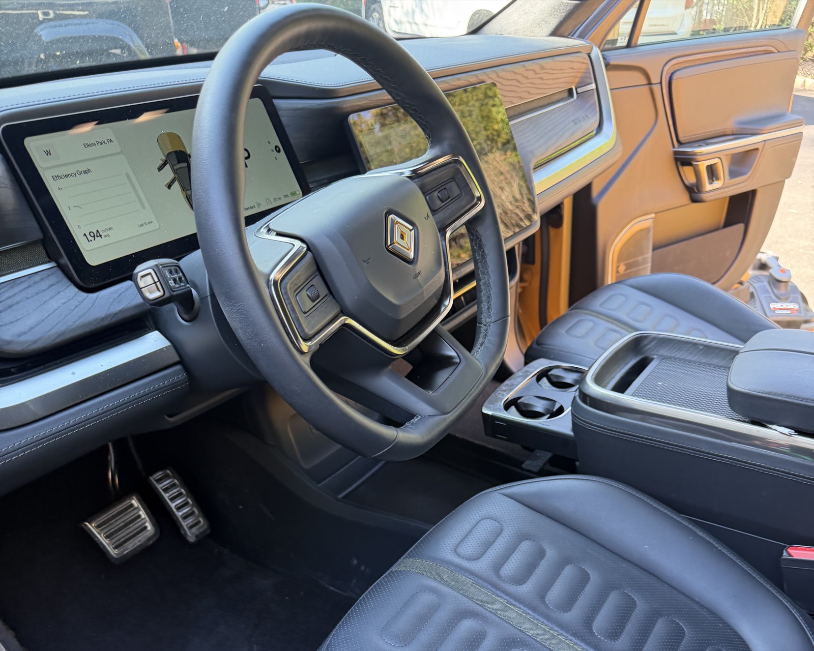 Spotless Rivian R1S interior — dash, wheel and seats detailed